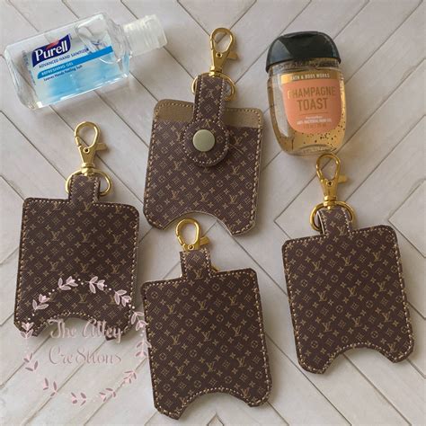 Louis Vuitton Sanitizer Holder .